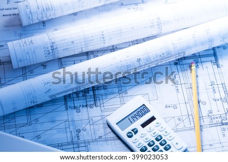 financing architectural project, blueprints rolls, calculator, pencil