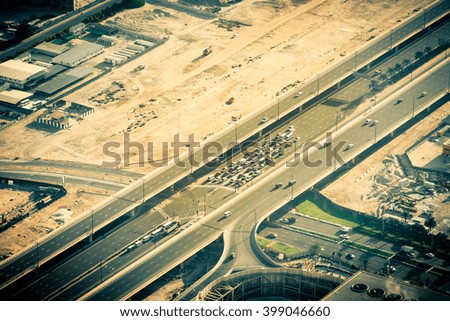 Top view of highway interchange in Dubai, UAE. Toned shot