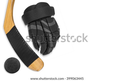 Hockey glove, stick and puck on a white background