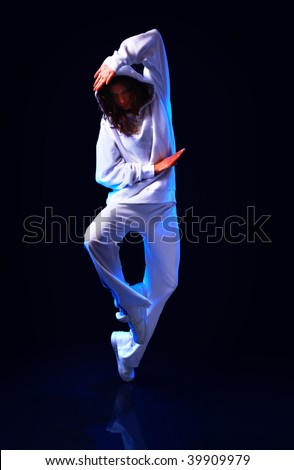 young female dancing on the grey background