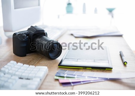 digital camera and colour swatches on an office desk