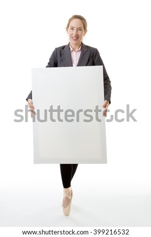 Full length shot of a business ballerina model, en pointe, holding a large blank card for an advert with copy space. isolated on white background.
