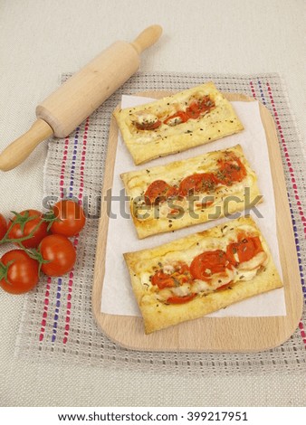 Puff pastry pizza with tomato and cheese