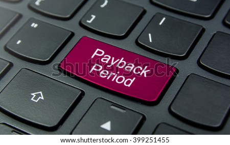 Business Concept: Close-up the Payback Period button on the keyboard and have Magenta color button isolate black keyboard