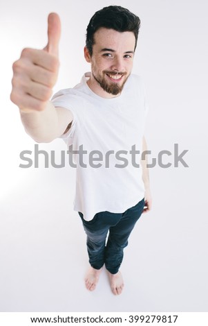 Man with thumbs up - isolated over light background