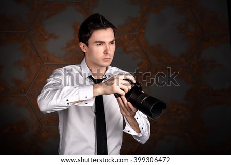 Professional photographer is looking at the object