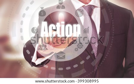 Businessman pressing an Action concept button.