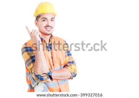 Joyful young engineer pointing finger a great idea as successful work concept isolated on white with copy space