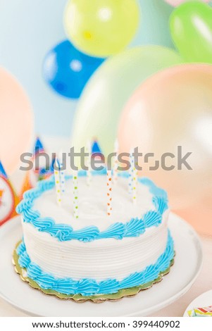 Simple white Birthday cake with cake candles.