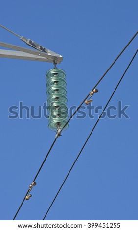 Insulators power lines. Photo of power lines against the blue sky.