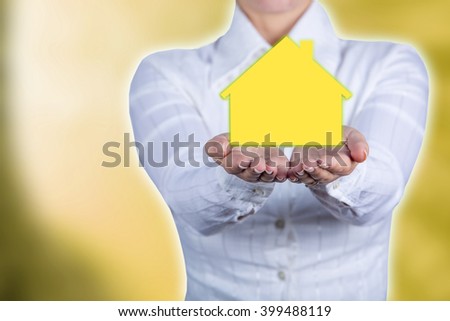 Propriety insurance concept ,Woman holding hands with a drawn family symbol.Family life insurance, family services, family policy concept.