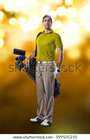 Golf Player in a yellow shirt, standing with a bag of golf clubs on his back, on a yellow lights Background.
