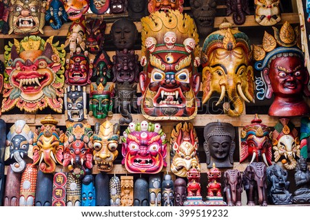 Colorful wooden masks and handicrafts on sale at shop in the Thamel District of Kathmandu, Nepal. Royalty-Free Stock Photo #399519232