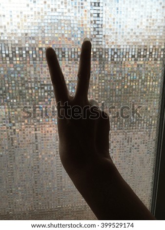 Woman hand on glass windows