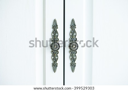Vintage white wooden cupboard doors with metal handles