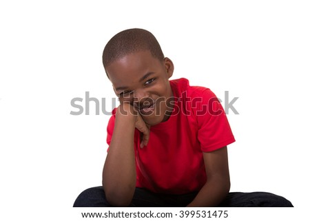 Smiling school aged boy isolated on white