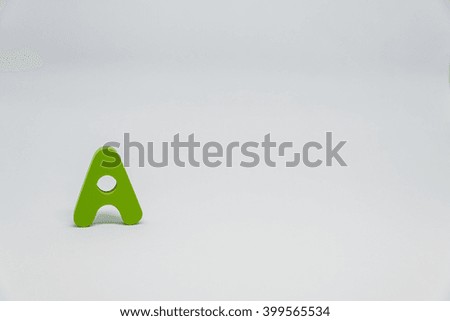 Green Wooden alphabet A with white background
