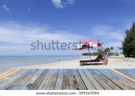 wooden floor with beach and blue sky  for background