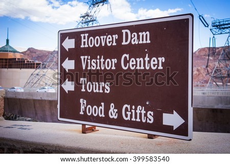 Arrow points directions to tourists and visitors at the Hoover Dam location in the American southwest.