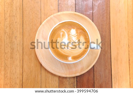 hot coffee cappuccino in cup on wood table
