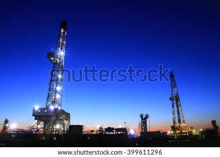 In the evening of oilfield derrick