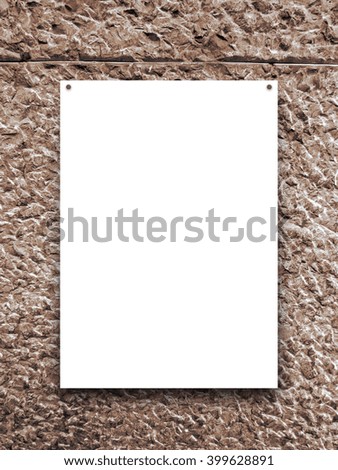 Close-up of one nailed blank frame on brown concrete wall background