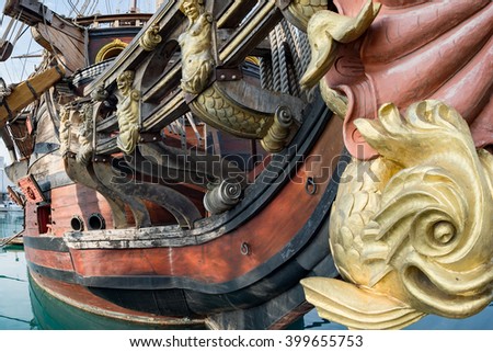 gold statues on pirate sail ship detail
