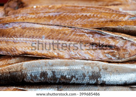Stack of smoked fish, close up, background