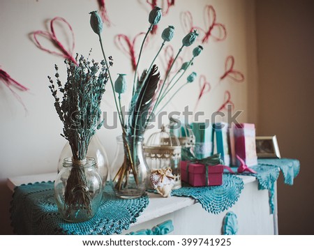 Vintage decoration with lavender flowers bouquet and dry poppy on the on a shelf; shot in shallow depth of field, lavender in a focus
