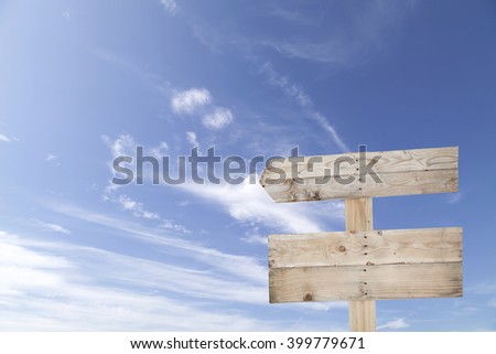 wooden signboard on blue sky for summer background with copy space
