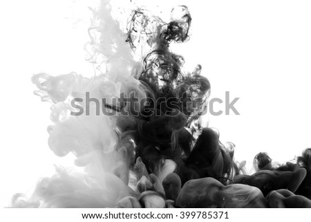 Abstract acrylic black and white paint swirls in water on white background