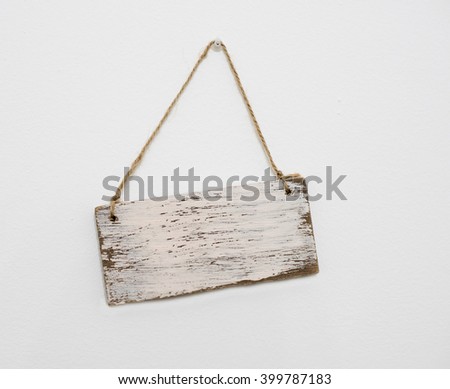 blank wooden sign hanging on the wall