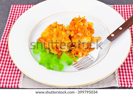 Fish in Greek with Onion and Carrot Studio Photo