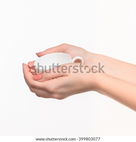 Woman hand with cup on white background
