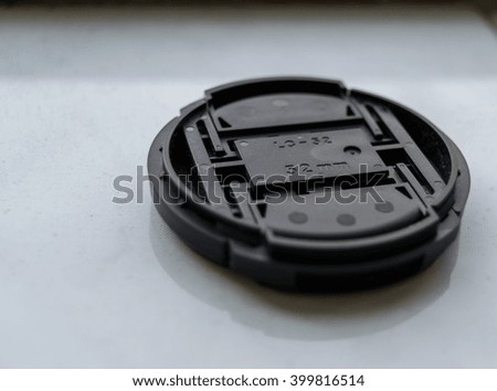 camera lens cap on tiles