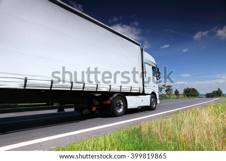 Truck transportation on the road Royalty-Free Stock Photo #399819865