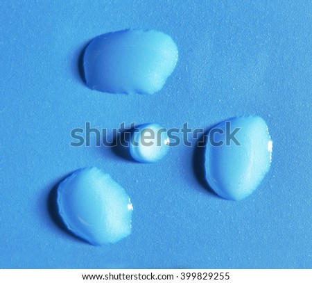 Radiation sign made of water drops on blue background