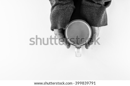 hand and a cup of coffee