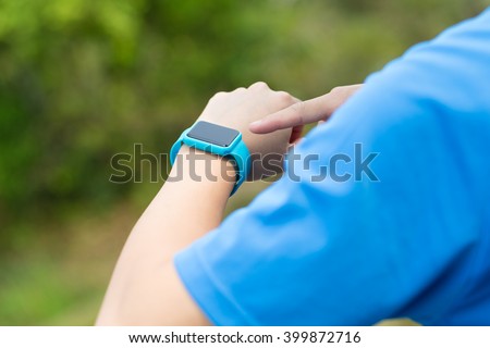 Man using smartwatch with sporty wear