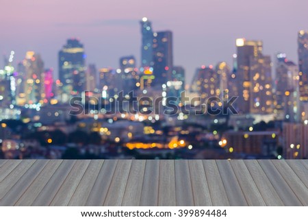 Opening wooden floor, Abstract blurred bokeh city lights downtown background