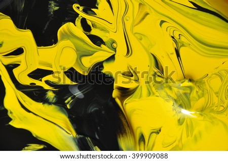 colored paint, mixing yellow and black, background