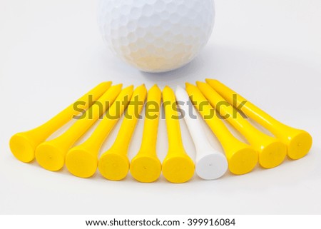 Wooden golf tees on the white background