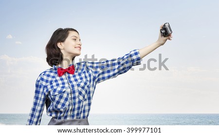 Hipster girl with photocamera