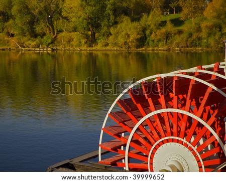 red river boat paddle wheel in water with trees Royalty-Free Stock Photo #39999652