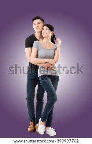 Attractive young Asian couple, full length portrait isolated.