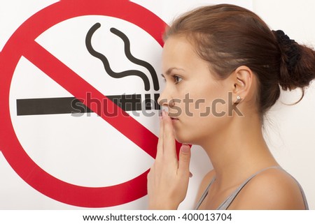 Woman. No smoking concept a no smoking sign