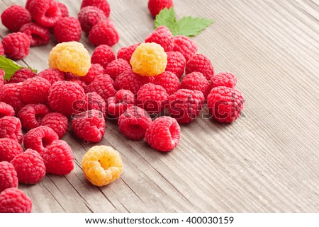 Raspberries on wooden background. Close up, high resolution product