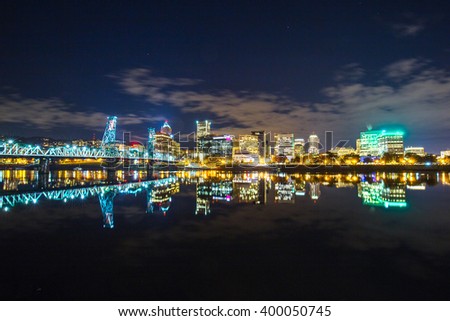 water with reflection and cityscape and skyline of portland at night