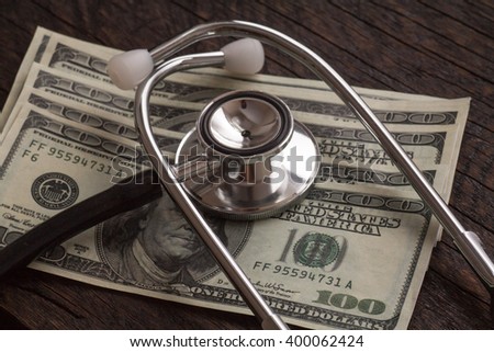 Stethoscope on money background - medical concept