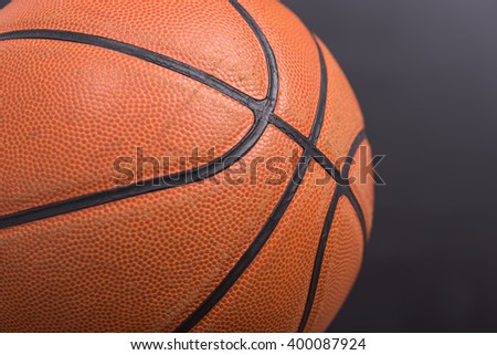 Closeup old basketball basket ball on wooden and black background